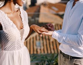 Bride and groom exchanging rings at wedding