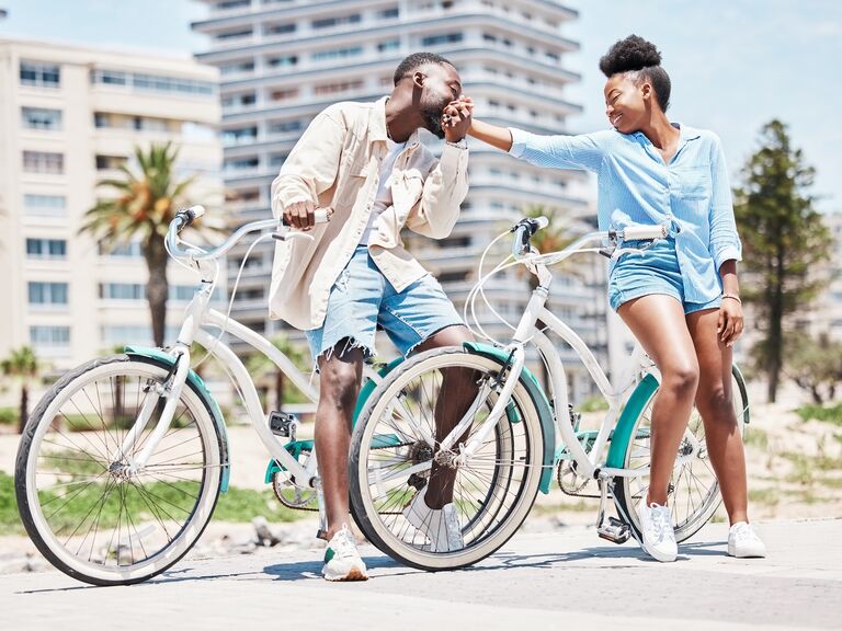 Black man, kiss woman hand and outdoor park holiday in miami