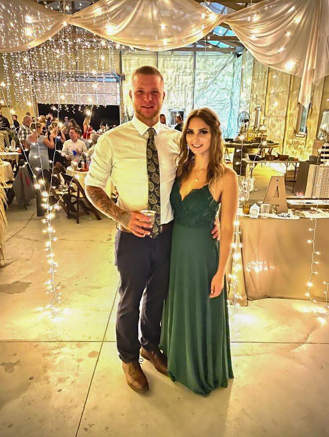 Lukas and Katie's first photo together at a friend's wedding.