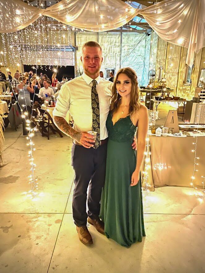 Lukas and Katie's first photo together at a friend's wedding.