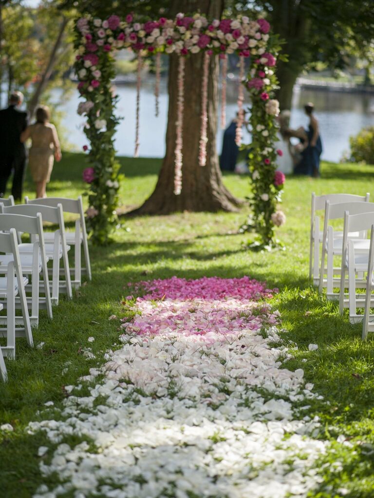 Ceremony aisle lined with ombre flower petals. 