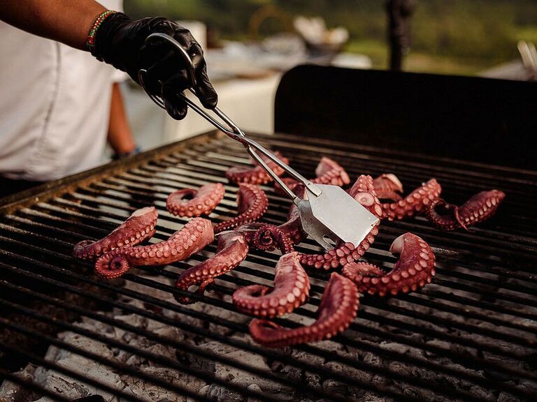 Grilled octopus at outdoor summer wedding reception