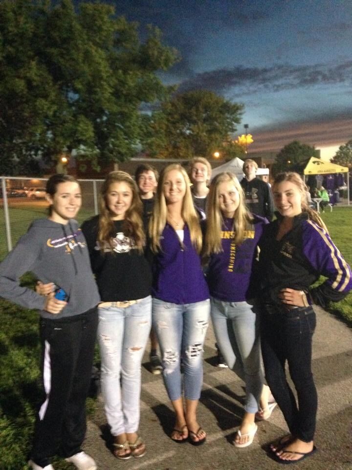 Abbie and Joe's story began in the Johnston school system, where they knew of each other but aren't entirely sure if they ever formally met. However, a glimpse into their early connection exists in the form of Joe's photo-bomb of Abbie and her friends at a high school football game.