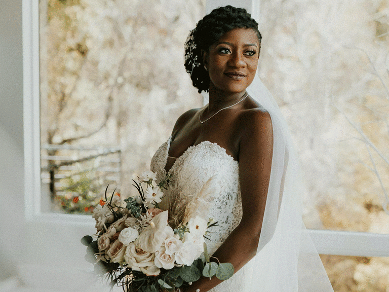 Bride holding bouquet for bridal portrait.