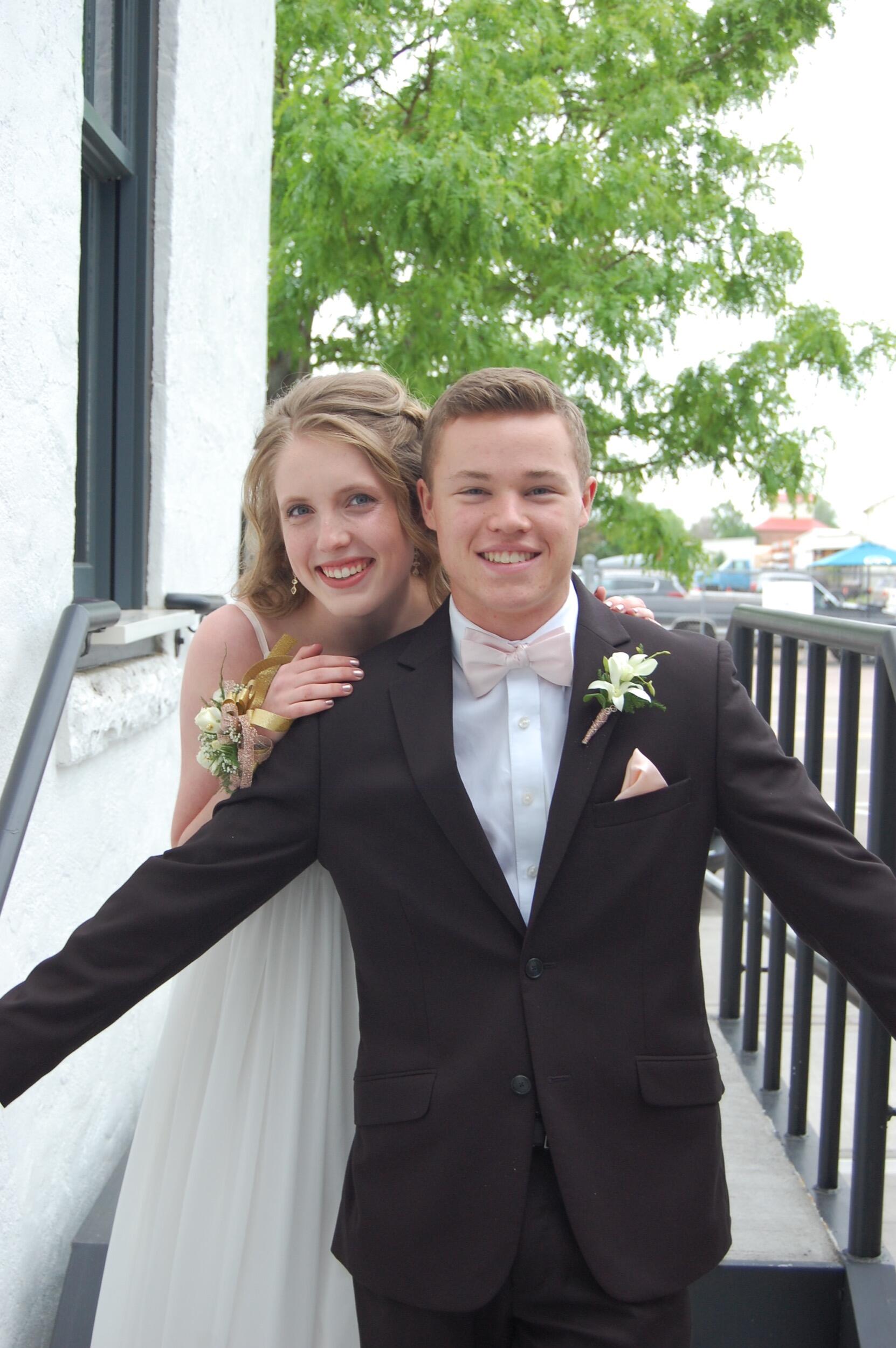 Sam & Elisa continued to date throughout high school. A highlight was attending each other's homecomings and proms as they attended different schools. This picture is of their first prom together!