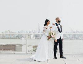 bride with hand on groom's shoulder nyc skyline backdrop