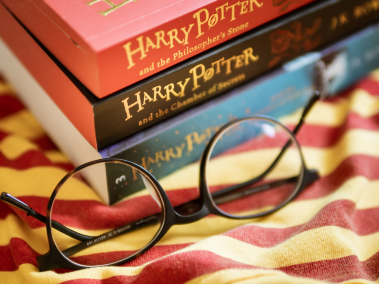 Stack of harry Potter books with glasses