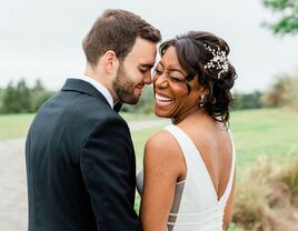 Bride and groom posing for formal wedding portraits