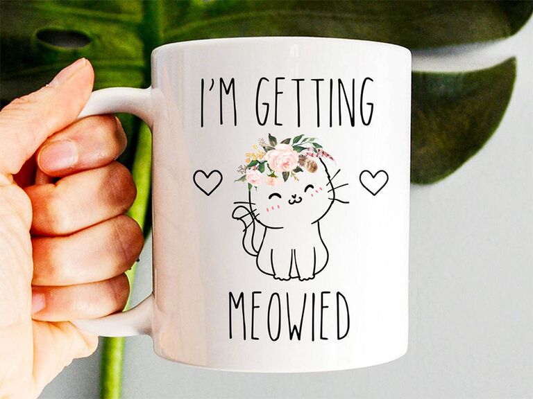'I'm getting meowied' in playful black type and kitten with flower crown graphic on white mug