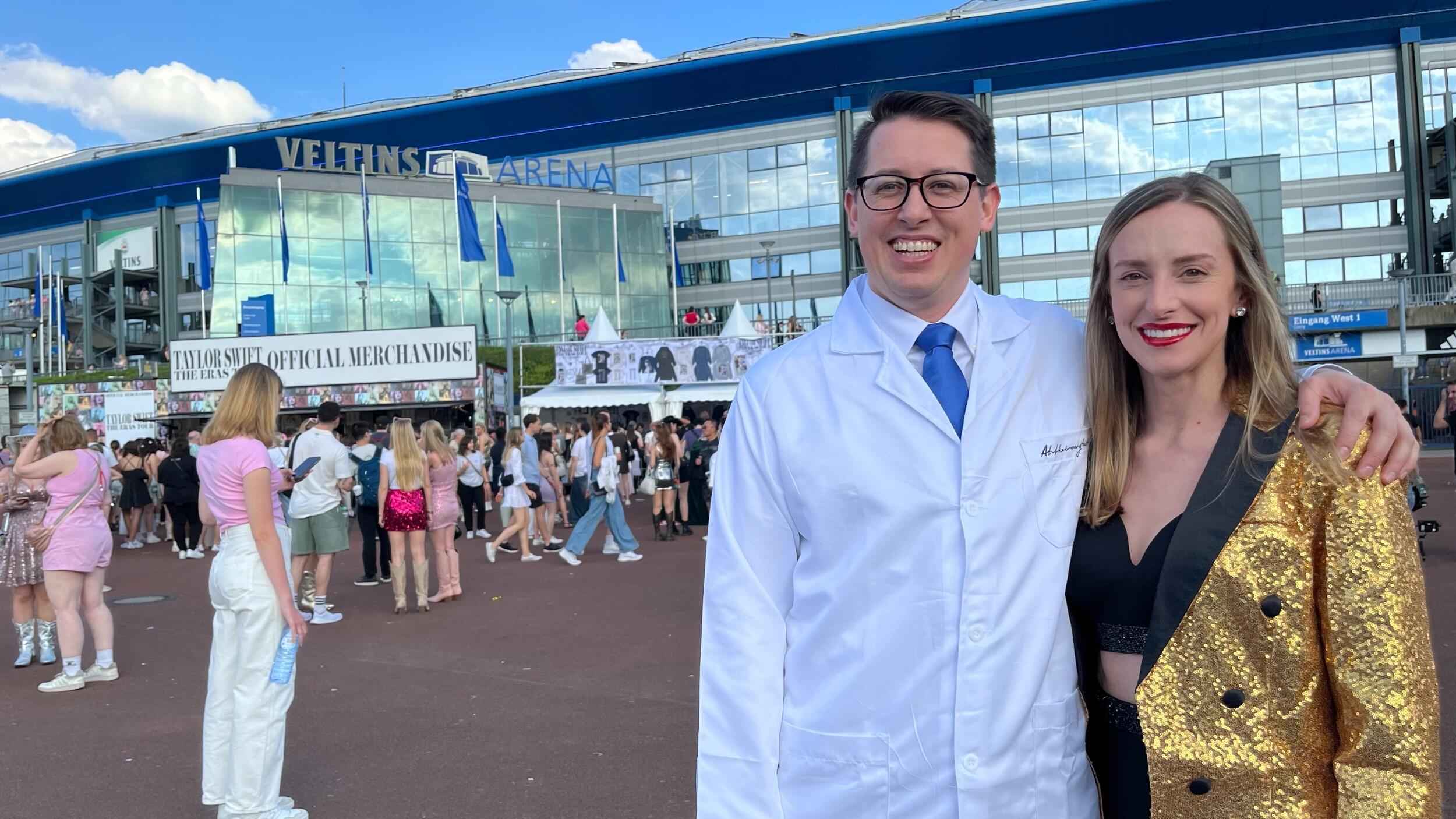Kirsten and Tyler attend The Eras Tour in Gelsenkirchen, Germany. A nice man sees them taking a selfie and offers to take their photo outside the stadium; it turns out he is a German journalist who ends up interviewing them for his newspaper!