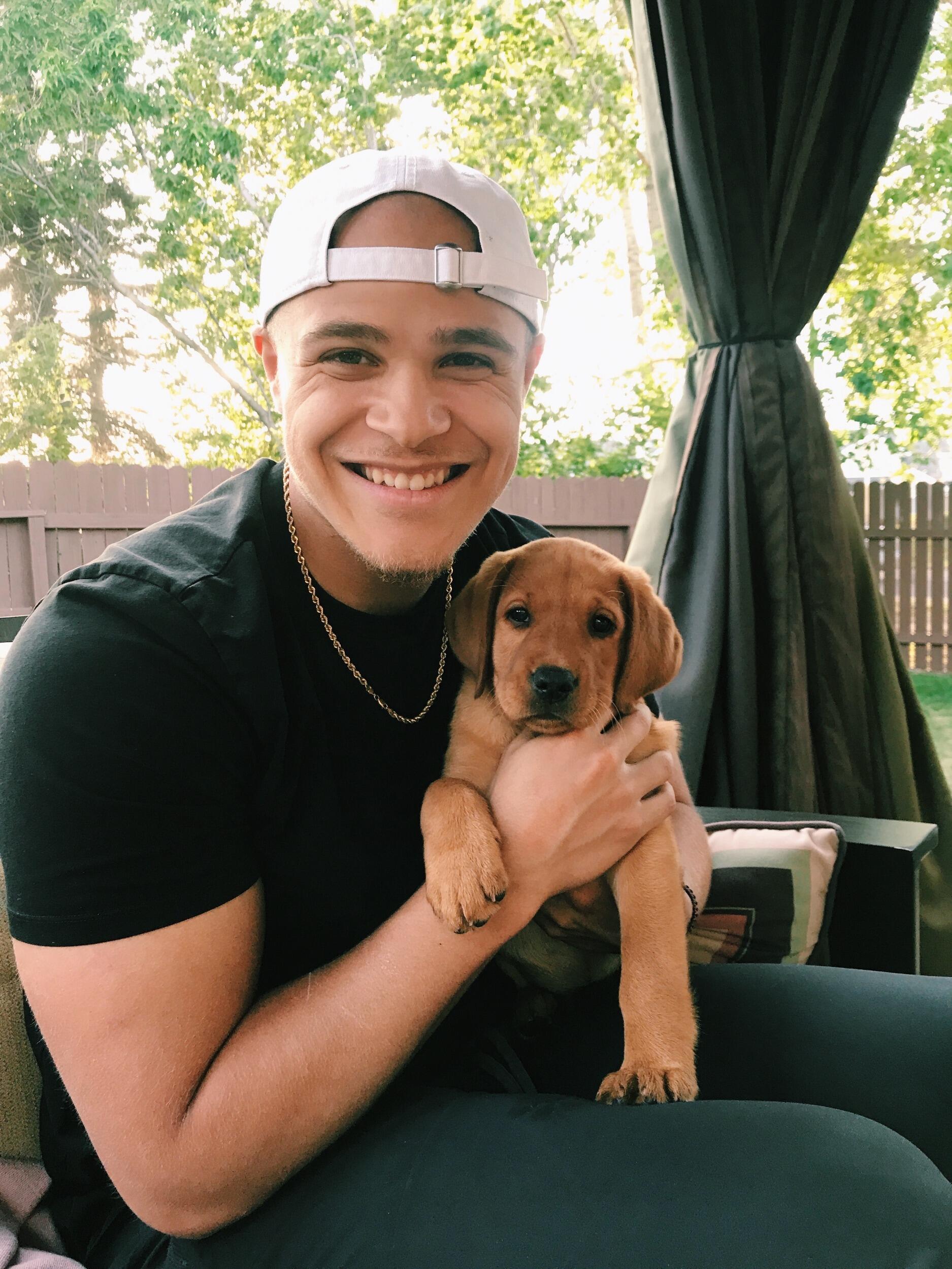 Snuggling Ryan's new puppy Bailey!