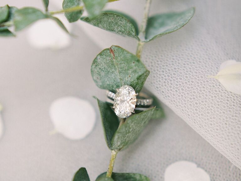 Engagement ring styled with sprig of eucalyptus