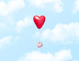 piggy bank with heart floating away for recession conversations couples