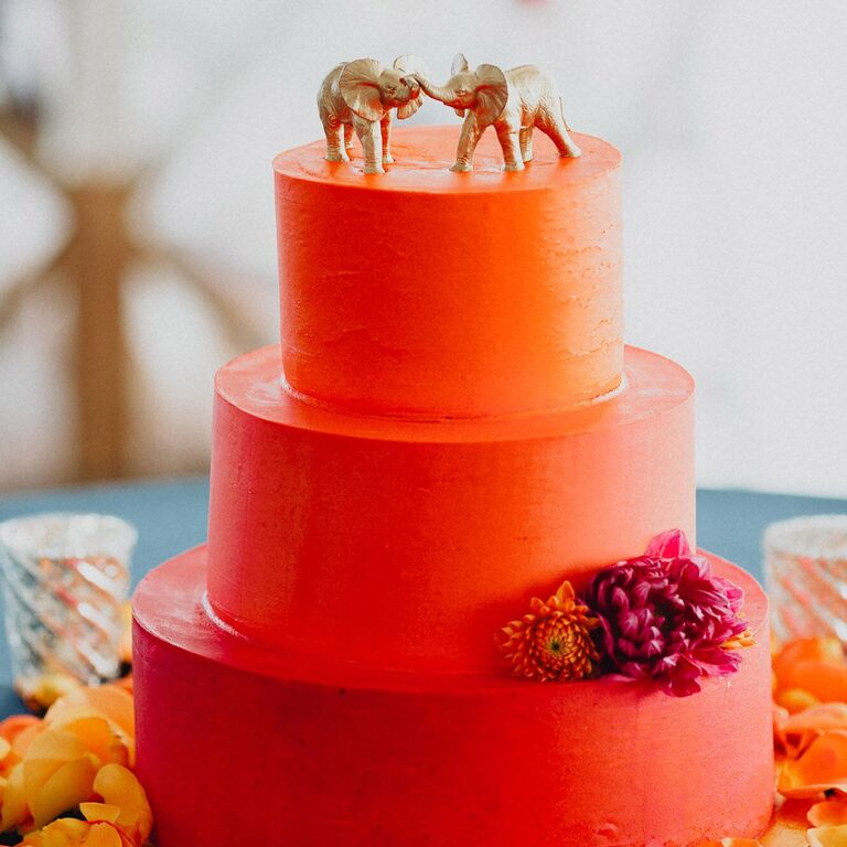 Three-tier bright orange wedding cake