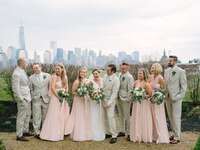 Wedding party wears summery tan suits. 