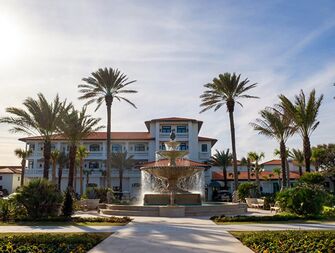 Outside view of Ponte Vedra Inn & Club and large stone waterfountain