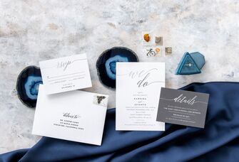 Minimalist foil wedding invitation suite ready to be mailed