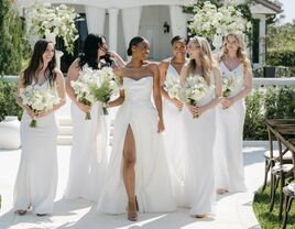 bride with bridesmaids wearing white dresses