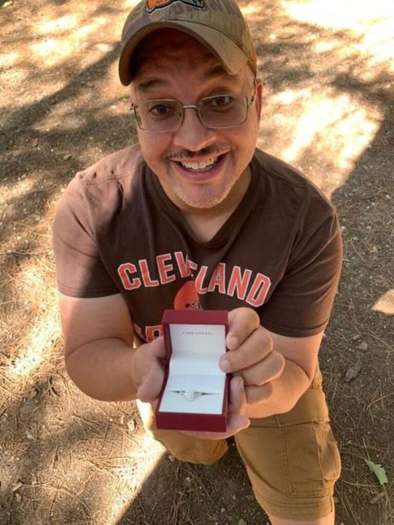 🙏This day represents a time of freedom for Danielle, a milestone she proudly celebrates with her fellows to recognize how far she has come since the day she surrendered. 🌟 On the night of September 10, 2024, Jeremy told Danielle he wanted to take her somewhere special to celebrate her anniversary. She chose to spend the day at Mt. Lemmon, a place they had never been. 🏞️ Danielle packed a lunch for the two of them while Jeremy slipped away to make sure the only thing he needed was in his pocket. 💍 They set off, driving up to Mt. Lemmon, Arizona, enjoying the breathtaking scenery. 🚗 Unsure of where to go, they stopped in the small town and explored, with Jeremy buying Danielle a few souvenirs. 🛍️ Danielle noticed Jeremy's distraction but made the best of their amazing surroundings. They decided to drive down to an area with picnic benches surrounded by the forest and set up their romantic lunch for two. 🧺 Suddenly, Jeremy, very quiet, said, "Let's go over to that rock." Danielle, confused, followed as Jeremy guided her by the hand. As they stood near the rock at 3:43PM MST, Jeremy, shaking in a way Danielle had never seen, got down on one knee and asked, "Will you marry me?" Danielle screamed, "Yes, Jeremy Alan Richards!" This moment was filled with romance, love, and spirituality, marking the beginning of a beautiful journey together. 💖✨ "We are totally deserving of unconditional love" - Affirmations for Couples: A Recovering Couples Anonymous Pamphlet (2018)