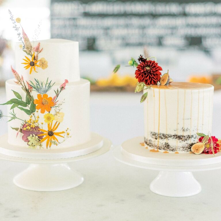 Two rustic wedding cakes with pressed flowers