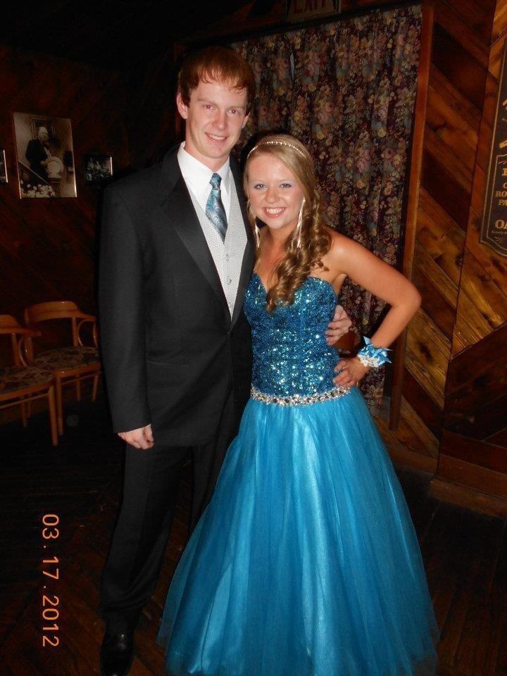 Garrett and Tori went to school together beginning in middle school. They knew of each other, but didn't become friends until high school. This is their first photo together during Senior Prom, although they didn't go as dates, they ended up spending most of prom hanging out with each other.