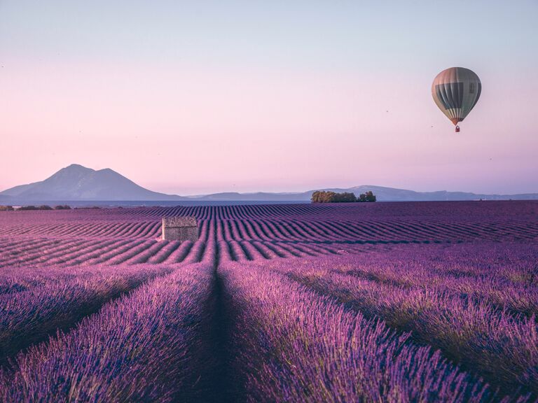 A hot air balloon rises over Provence, France