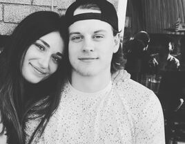 Black and white photograph of Joe Burrow and GIrlfriend Olivia Holzmacher.