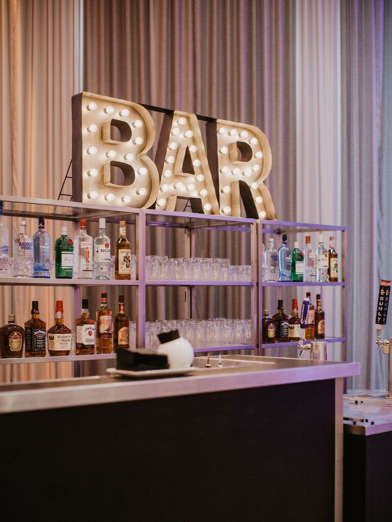 wedding bar with vintage marquee light letters spelling BAR 