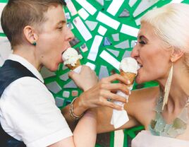 Brides eating ice cream cones on their wedding day