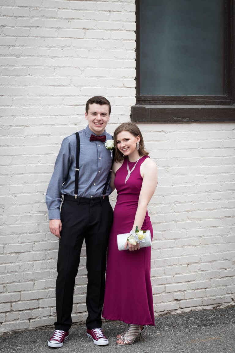 Our first date! Our first date was Connor's senior prom! We walked around downtown Lee's Summit and took pictures and got dinner! This photo is on the wall next to our wedding venue! Little did these kids know! 