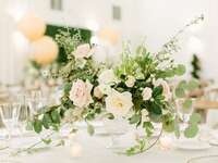 romantic wedding centerpiece with eucalyptus, greenery vines and roses