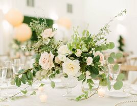 romantic wedding centerpiece with eucalyptus, greenery vines and roses