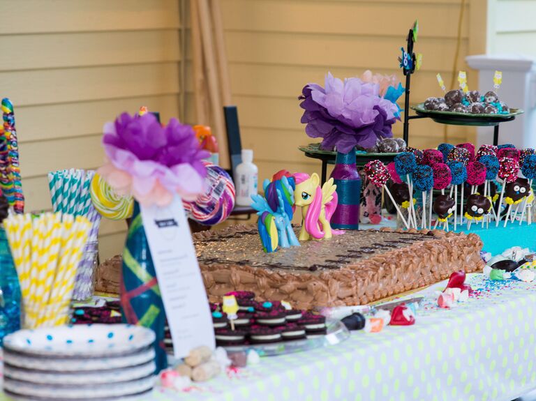 1990s party themed dessert table with colorful lollipops, striped paper straws and my little pony cake toppers