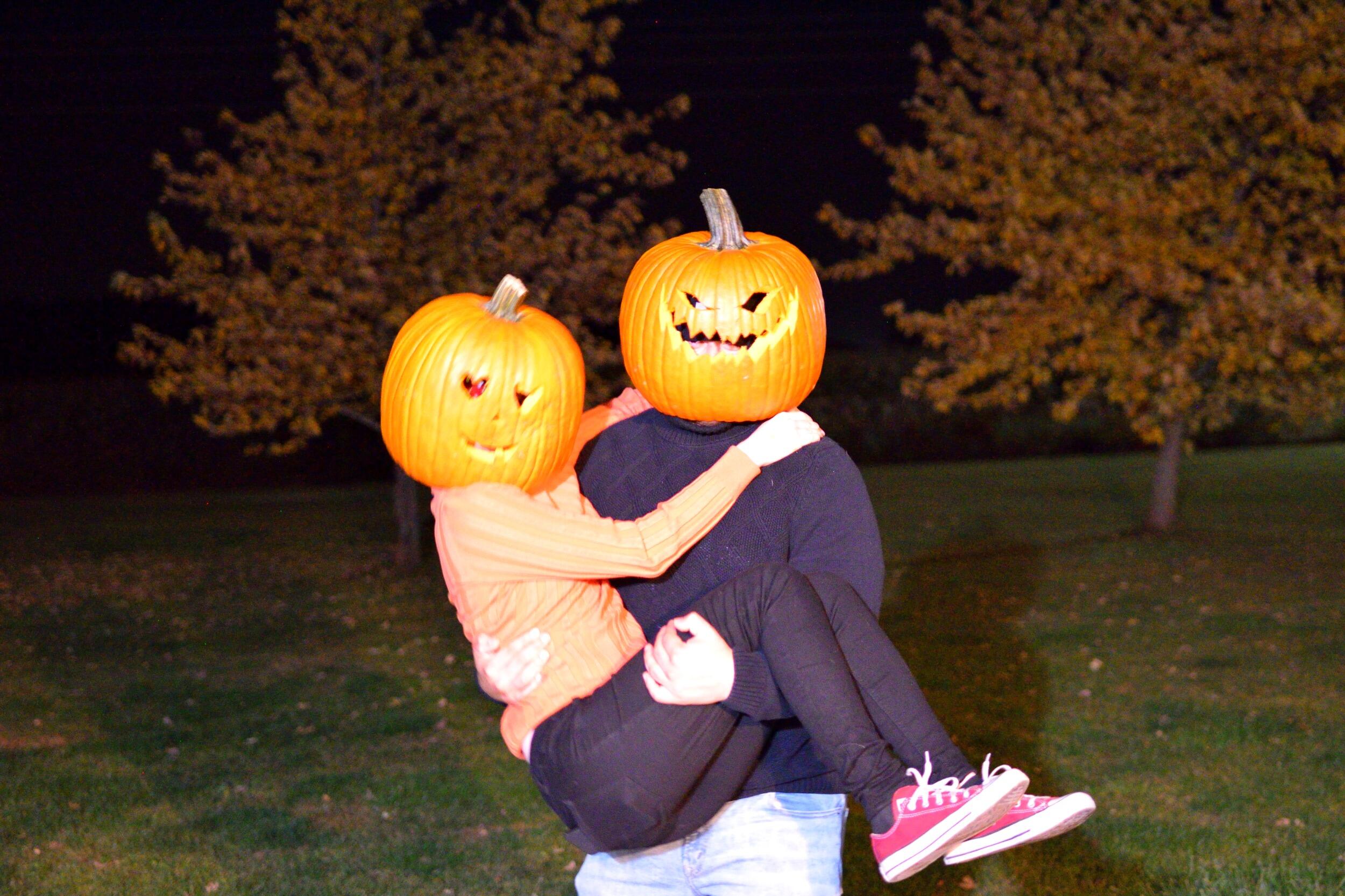 Octavio and Rachel carved large pumpkin's to fit on their heads.