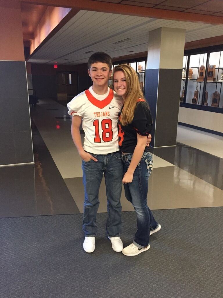 Derek asked Darby to wear his football jersey to the Friday night game!