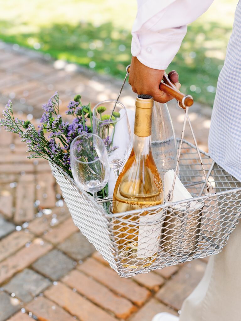 Welcome basket with fresh flowers and rose wine