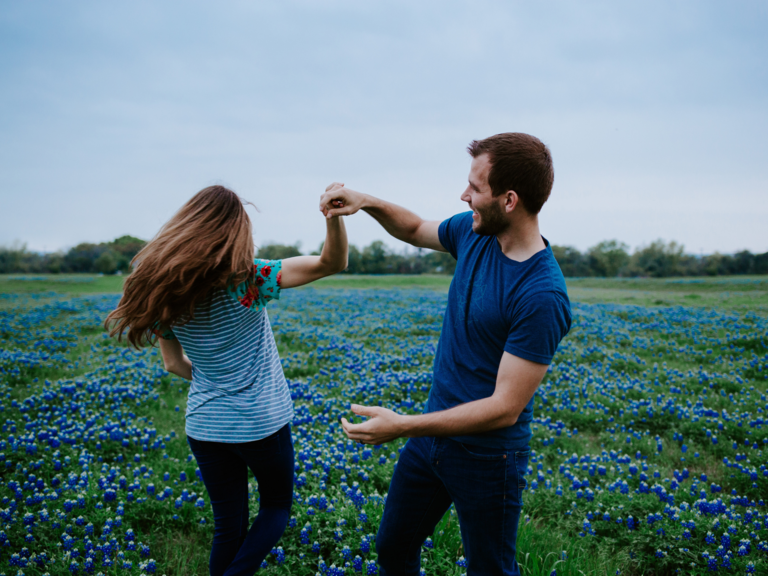 Couple dancing in bluebonnets field in Texas