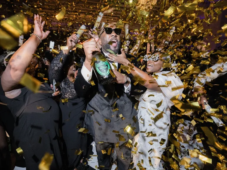 Gold Confetti and Dom Perignon Champagne During New Year's Eve Countdown at Wedding