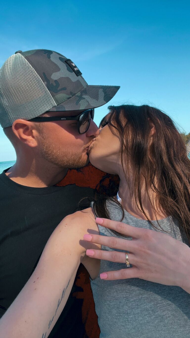 Lukas proposes to Katie at Longboat Key Beach in Florida. 