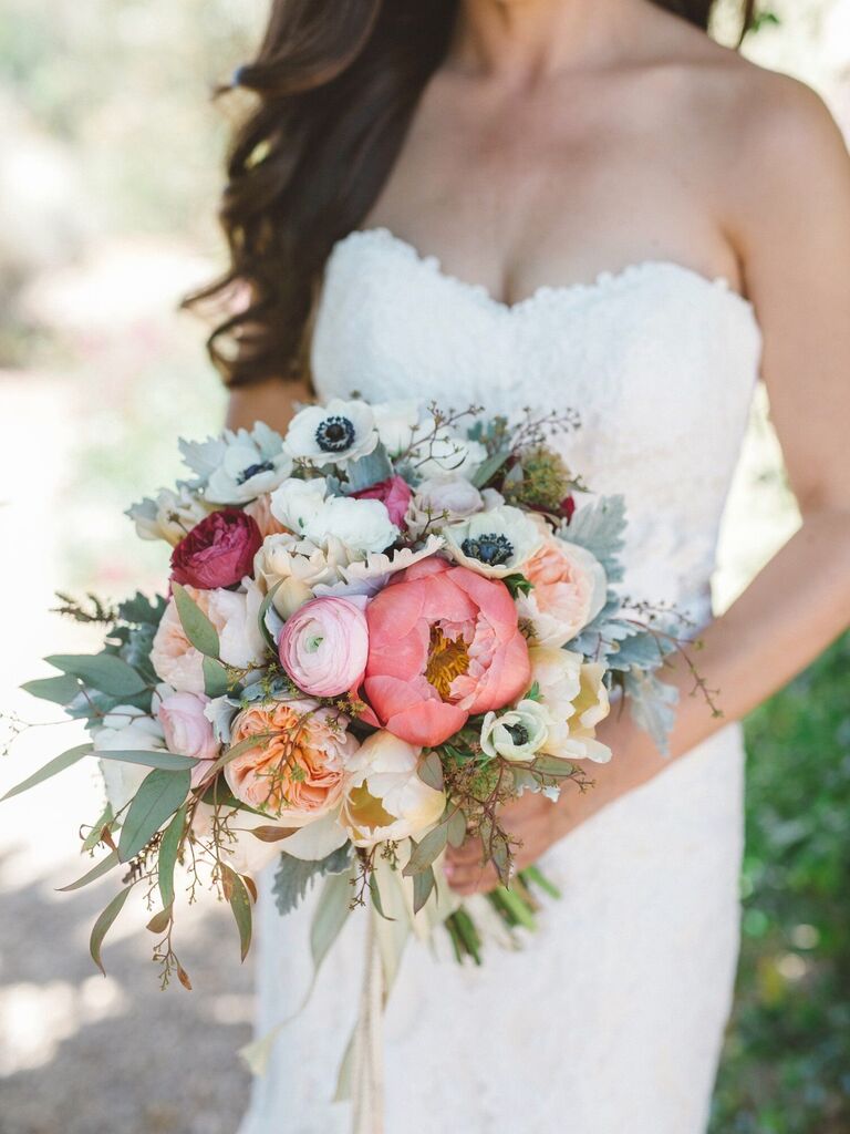 A multi-colored bouquet with peonies, anemones and roses.