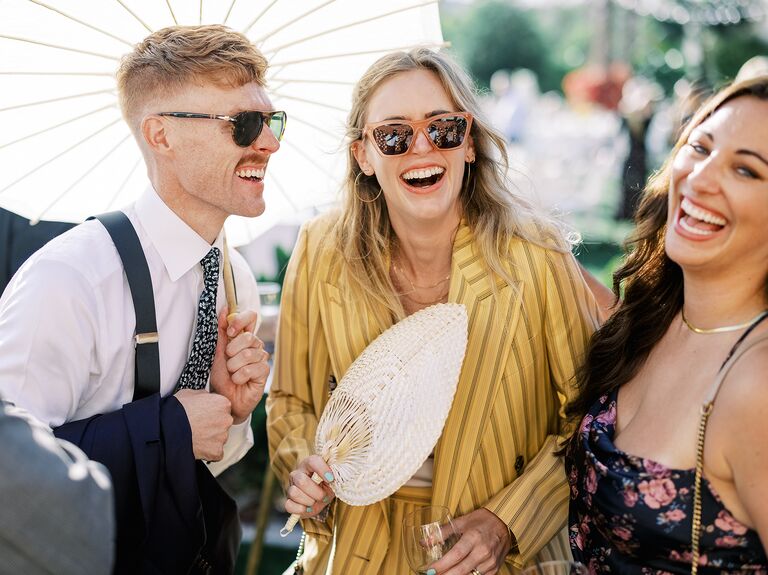 Wedding guest laughing together