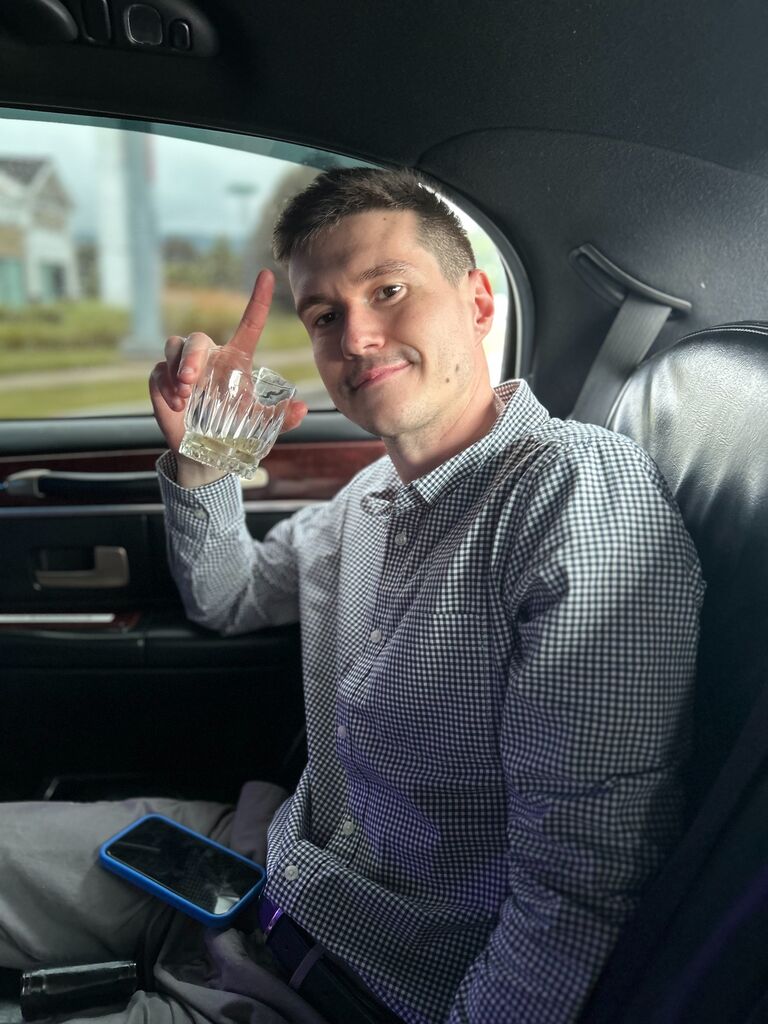 Patrick enjoying a well deserved drink on the limo drive back home after the proposal.