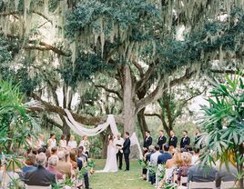 Couple exchanging vows at a backyard wedding