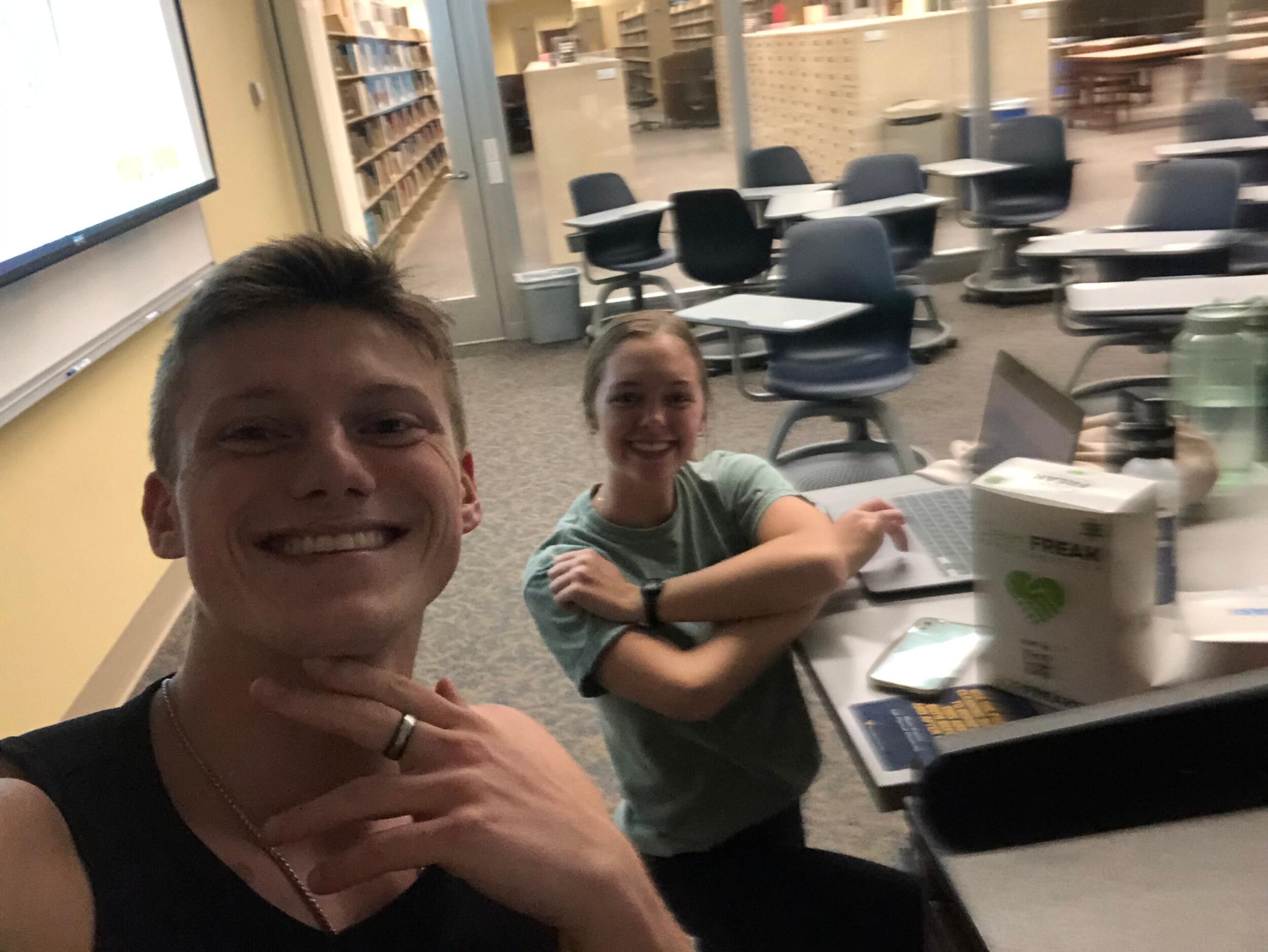 Our first photo together! One of many times studying at the library together.