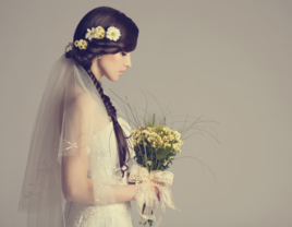 Bride with long hairstyle holding bouquet