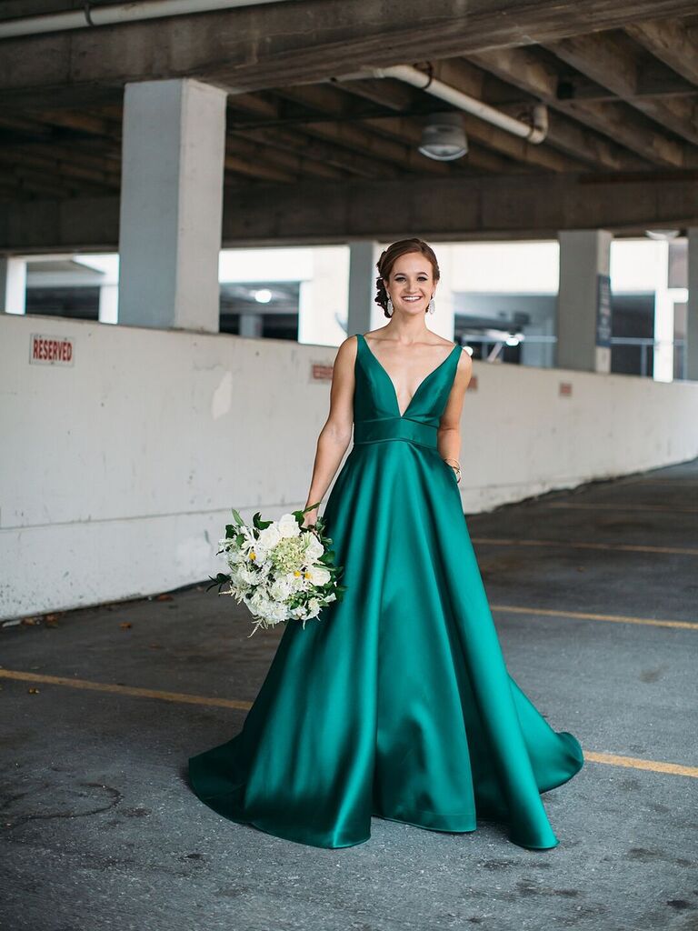 Bride wearing emerald green A-line wedding dress