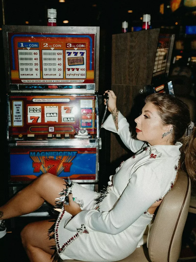 Wife Playing Casino Slot Machine in Las Vegas