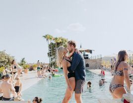 Couple having a wedding recovery day at the pool