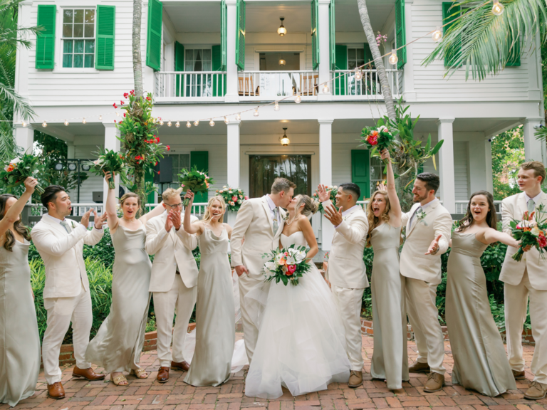 wedding party posed in front of Audubon House in Key West