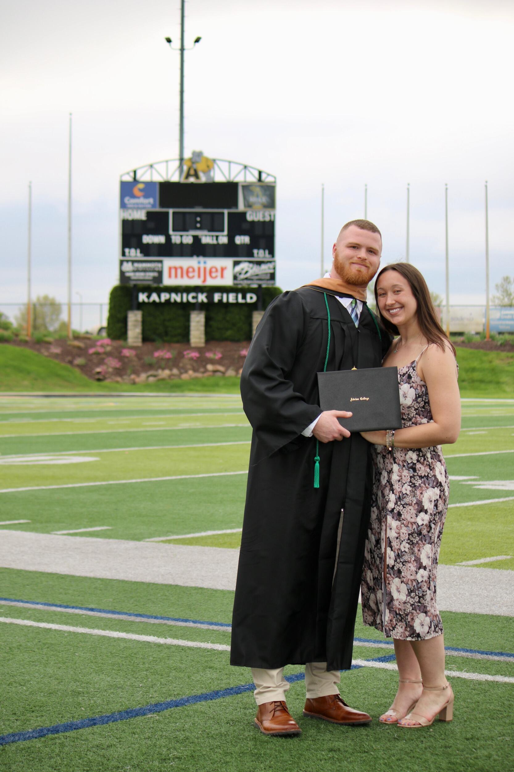 Tche graduated from Adrian College